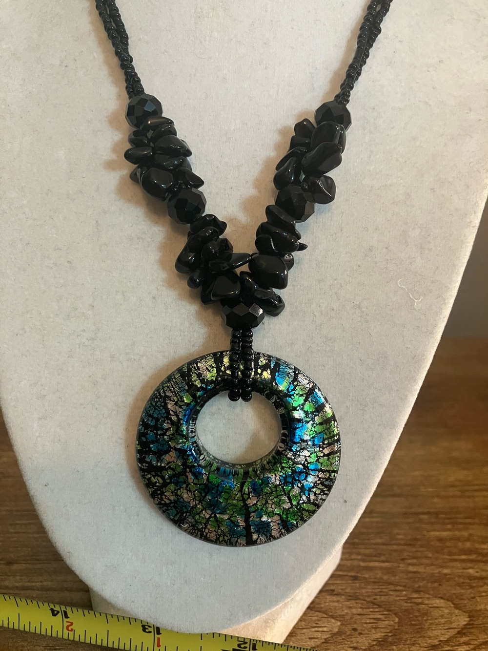 Black Beaded Necklace with Iridescent Blue-Green Donut Pendant